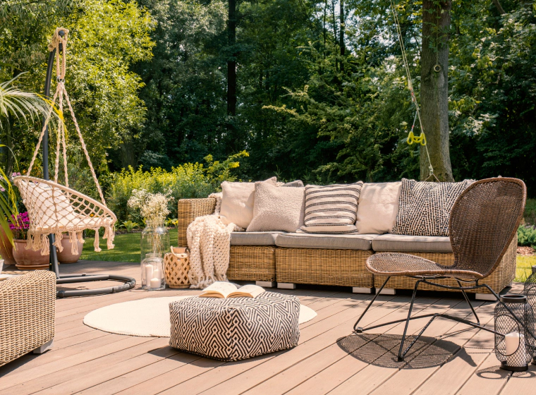 outdoor space with some sofas chairs and beige pillows